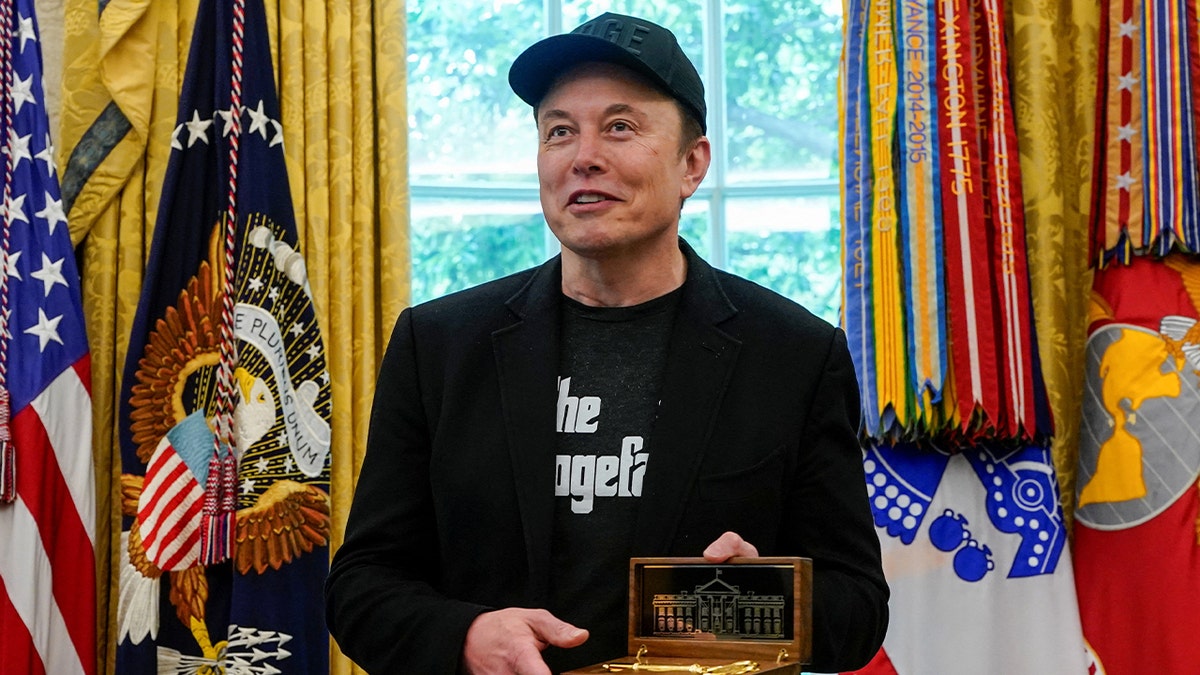 Elon Musk holds the "Key of White House" Received from President Donald Trump