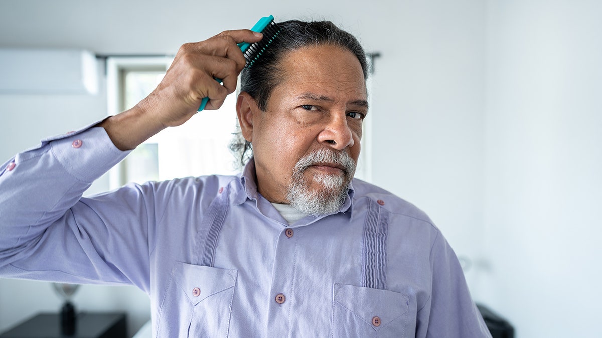 Man combines hair