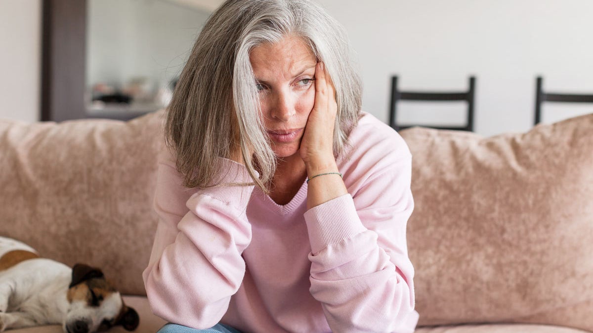 Sad woman on the couch